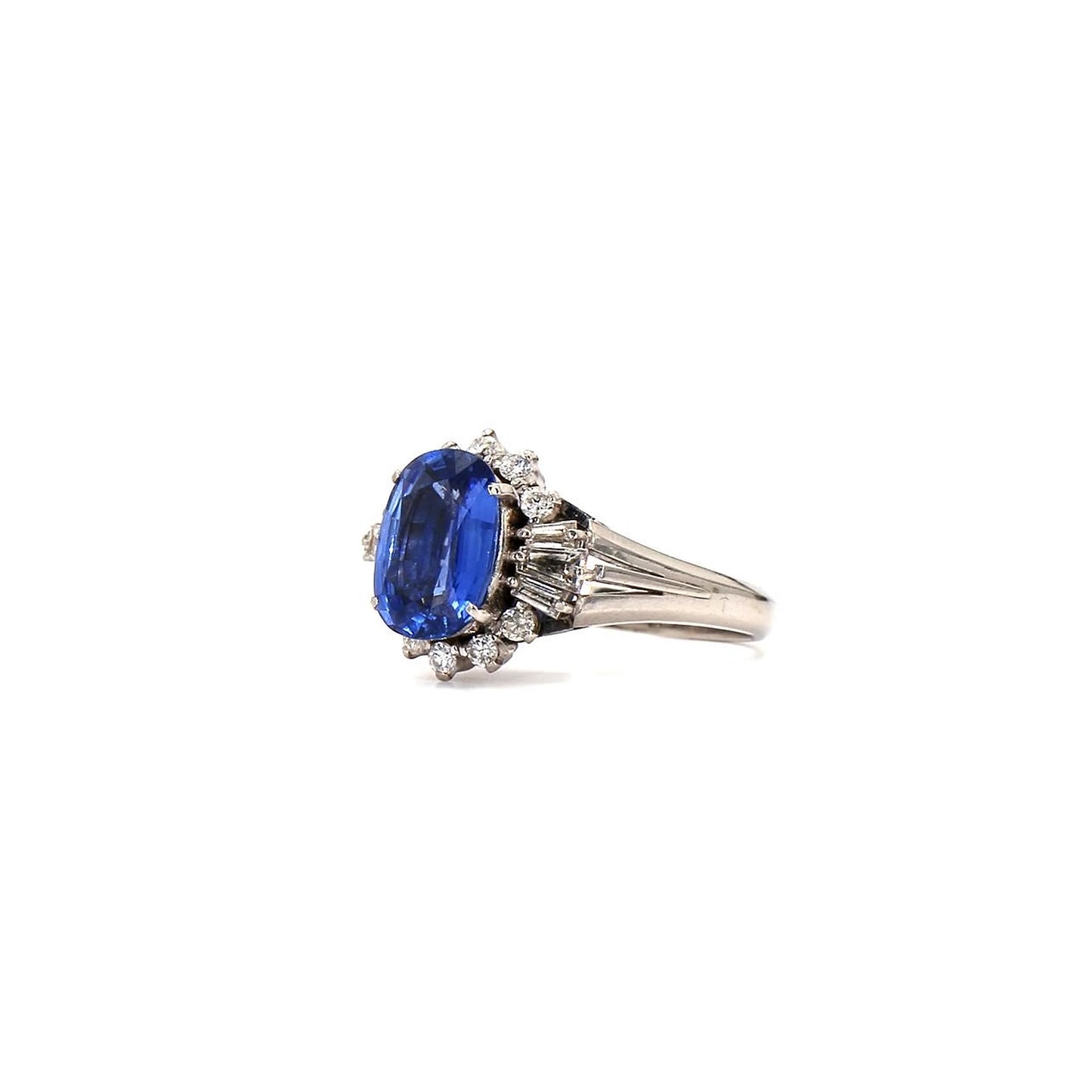 Classic Glamour: Oval Sapphire & Diamond Cluster Ring